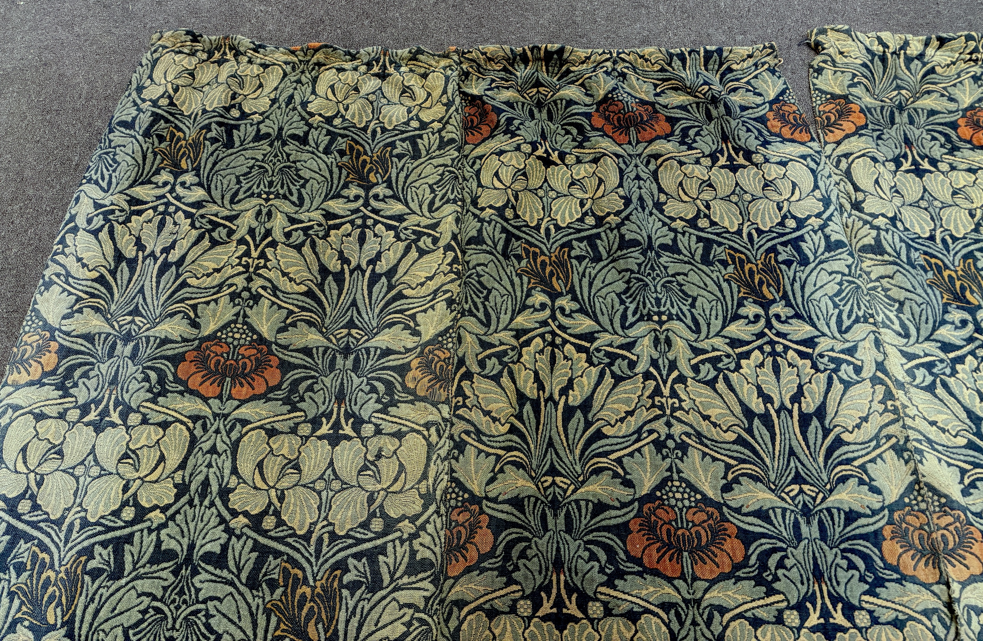 William Morris (1834-1896). Four panels of ‘Tulip and Rose’ triple woven wool and linen mix being two lengths sewn together creating a pair of wider curtains widest curtain (of two panels) 189cm wide x 158cm long, Single